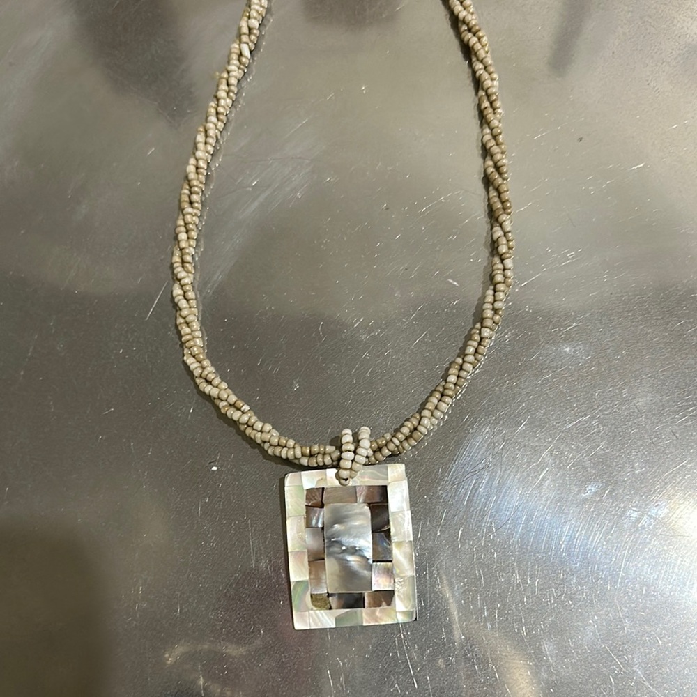 Elegant Beaded Necklace with Shell Pendant